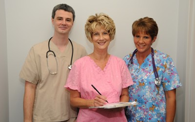 Three caregivers standing together