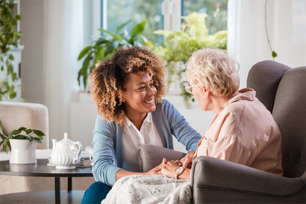 Caregiver talking with senior