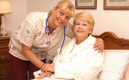 Recovery Patient in wheelchair with caregiver