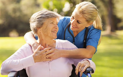 Caregiver with Patient in Wheelchair