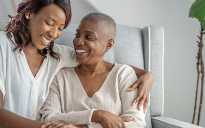 Mother and daughter sitting together