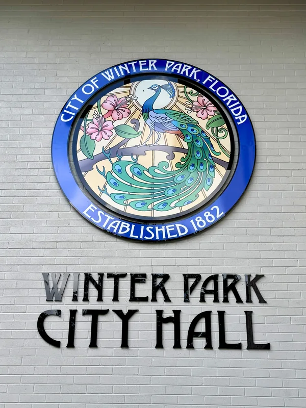 Winter Park City Hall sign and city seal on Park Avenue, Florida